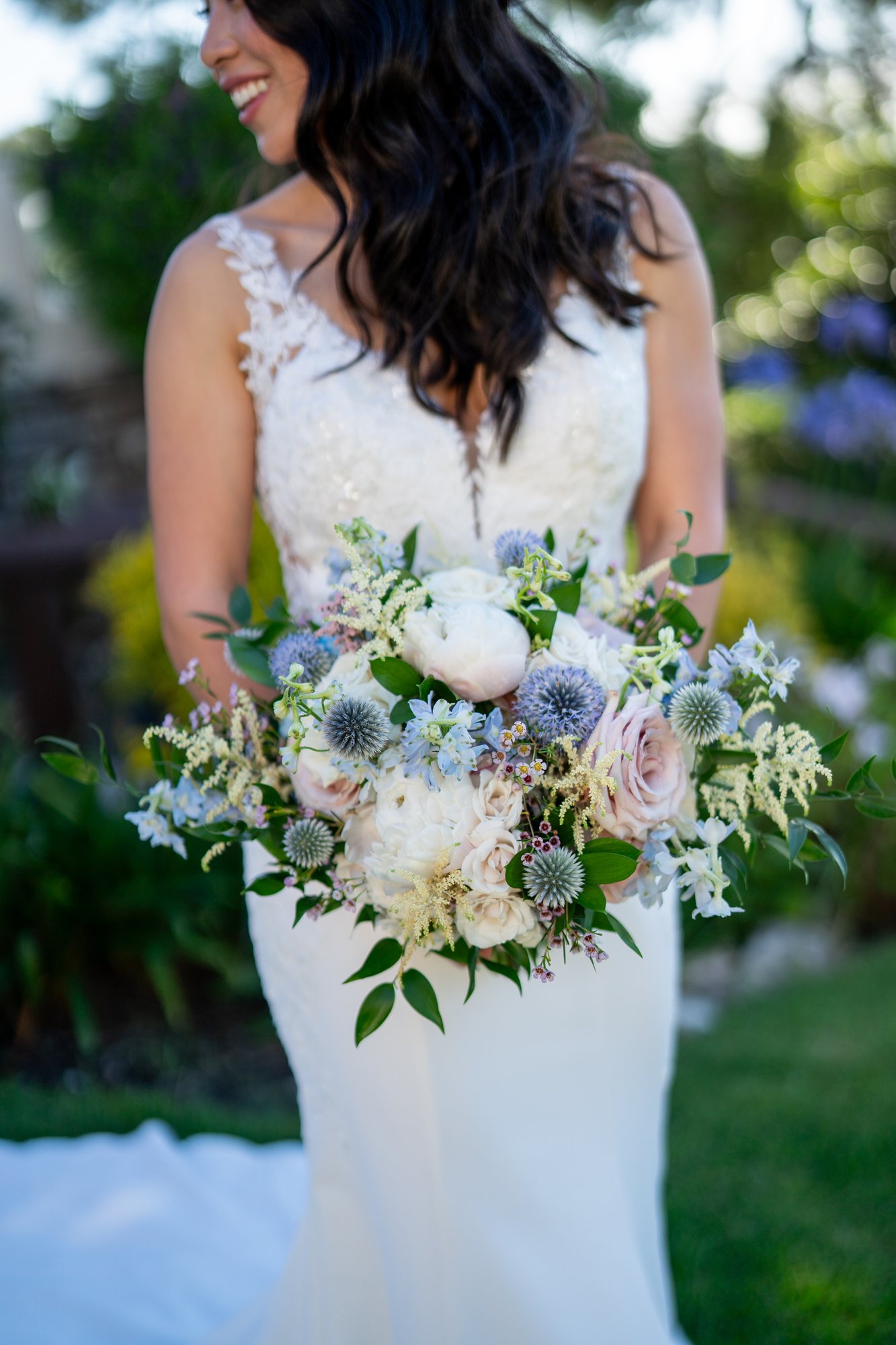 Bride holding a lush garden-style bridal bouquet