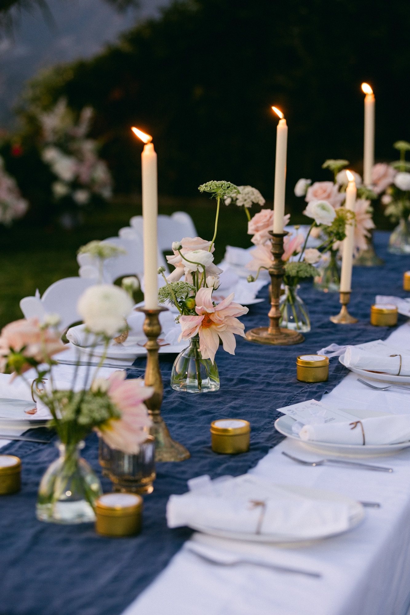 Candlelit reception tablescape with blush blooms