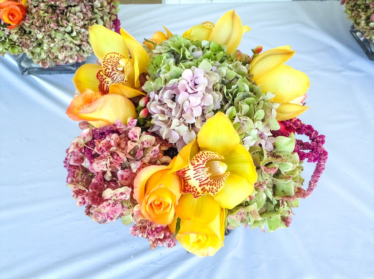 Vibrant bouquet of cymbidium orchids, hydrangea and roses